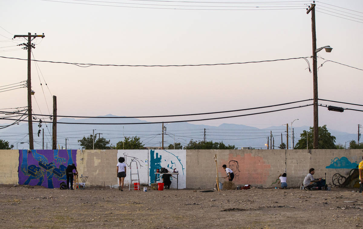 Artists work on murals at the site of the former Moulin Rouge in Las Vegas on Saturday, Oct. 3, ...