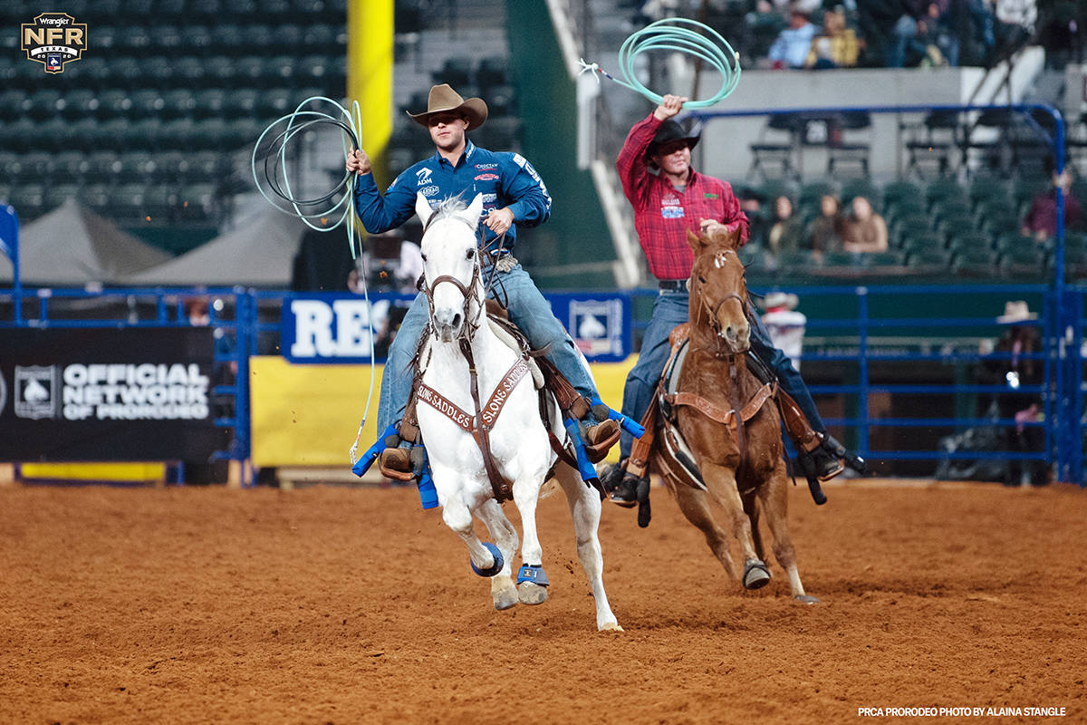 Clay Smith and Jade Corkill perform during the fifth go-round of the National Finals Rodeo in A ...