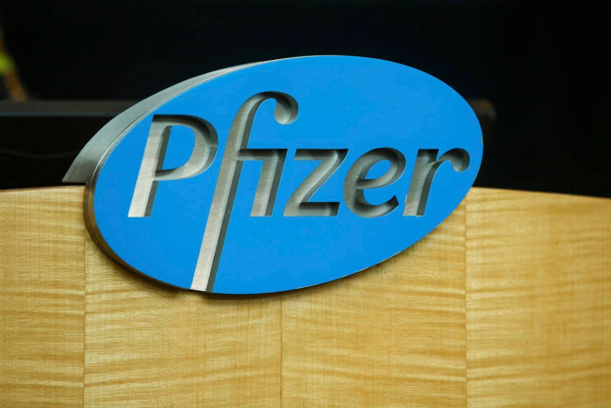 FILE - In this file photo dated Wednesday, July 22, 2020, a Pfizer sign is seen on a podium at ...