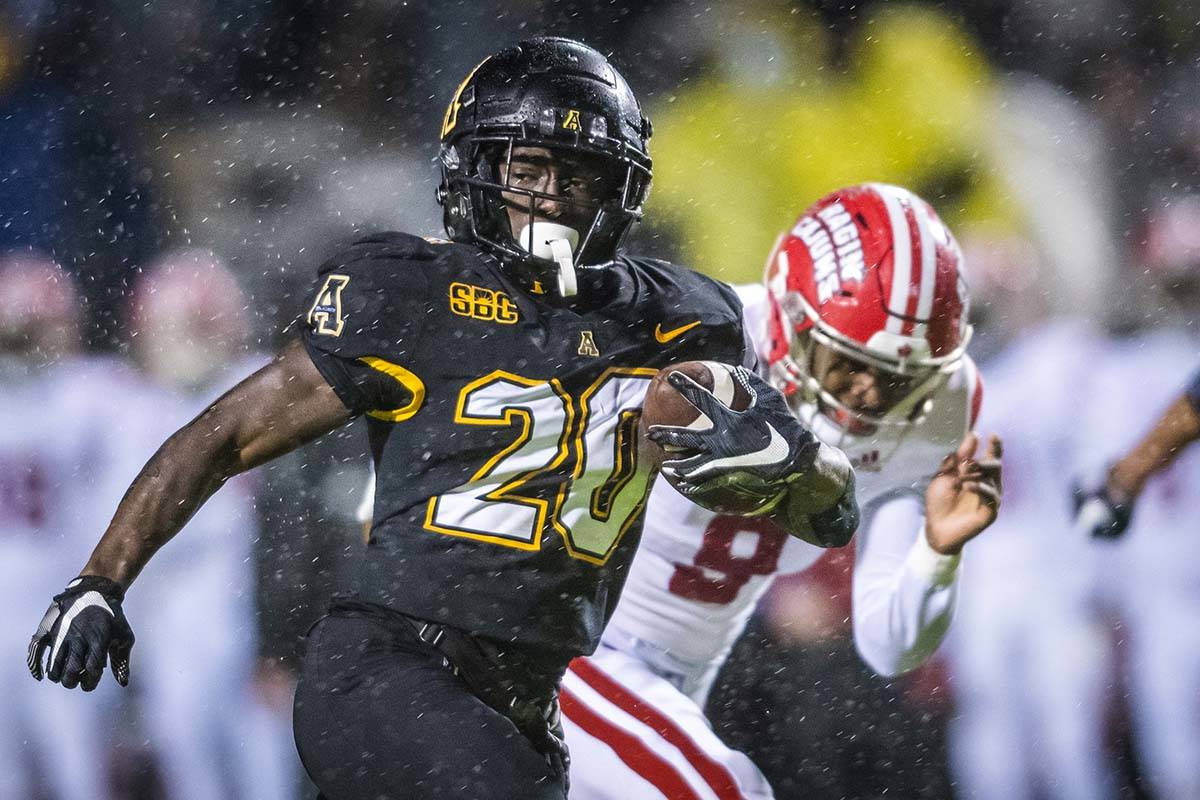 Appalachian State running back Nate Noel (20) runs the ball on his way to a touchdown against L ...