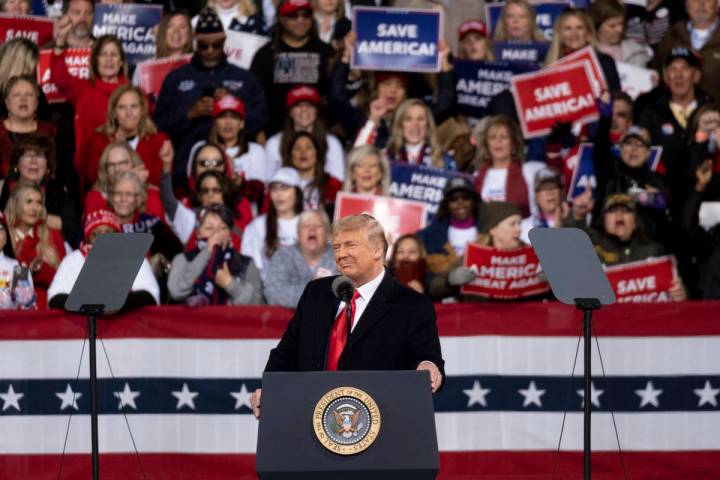 President Donald Trump addresses the crowd at a rally for U.S. Senators Kelly Loeffler, R-Ga., ...