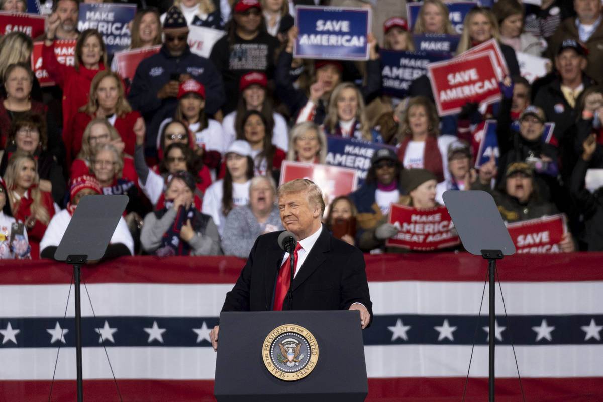 President Donald Trump addresses the crowd at a rally for U.S. Senators Kelly Loeffler, R-Ga., ...