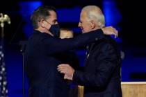 In this Nov. 7, 2020, file photo, President-elect Joe Biden, right, embraces his son Hunter Bid ...
