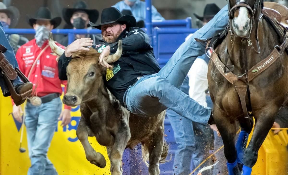 Clayton Hass performs during the 7th go-round of the National Finals Rodeo in Arlington, Texas, ...