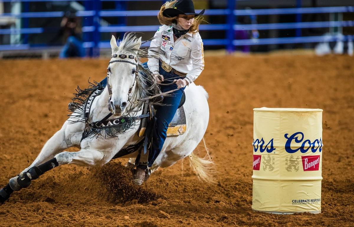 Emily Miller performs during the 7th go-round of the National Finals Rodeo in Arlington, Texas, ...