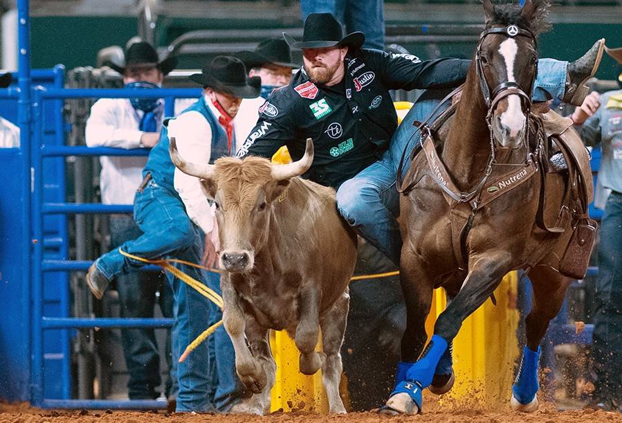 Clayton Hass performs during the 7th go-round of the National Finals Rodeo in Arlington, Texas, ...