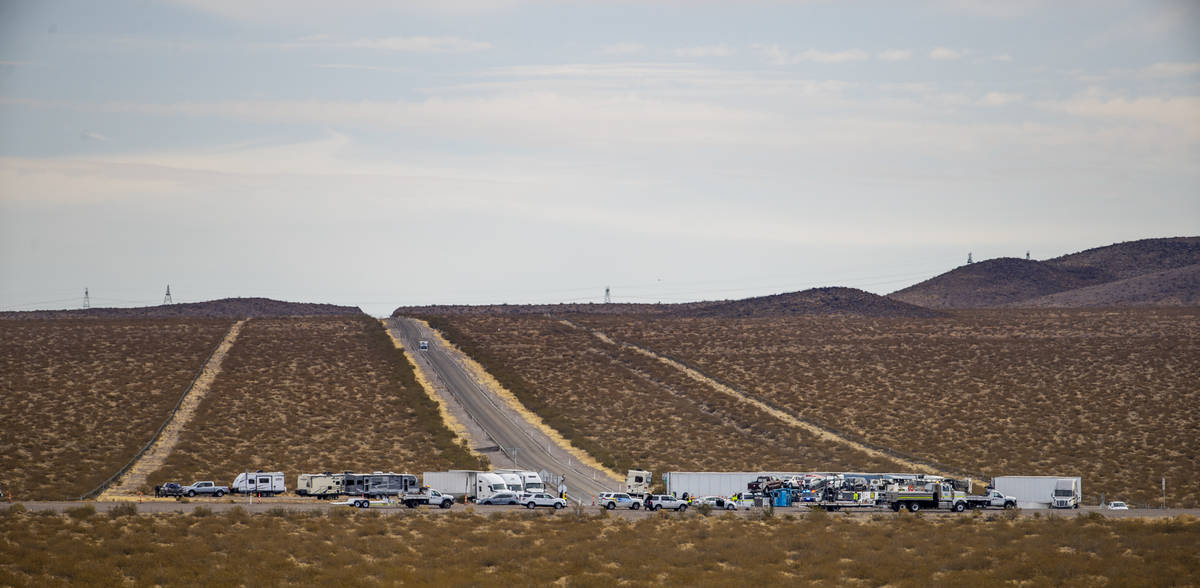 Trucks are staged at the Nelson Road cutoff as the Nevada Highway Patrol works the scene of a f ...