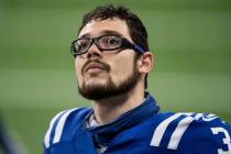 Indianapolis Colts kicker Rodrigo Blankenship (3) watches a video replay during an NFL football ...