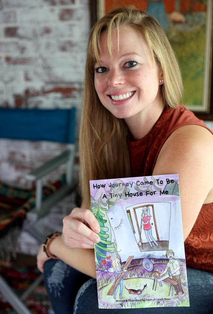 Hannah Doss and her book in her tiny home in Boulder City Friday, Dec. 11, 2020. Doss bought th ...