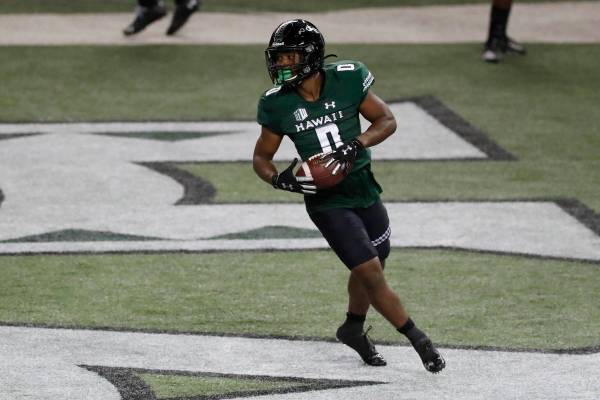 Hawaii running back Dae Dae Hunter turns after scoring a touchdown against UNLV during the firs ...