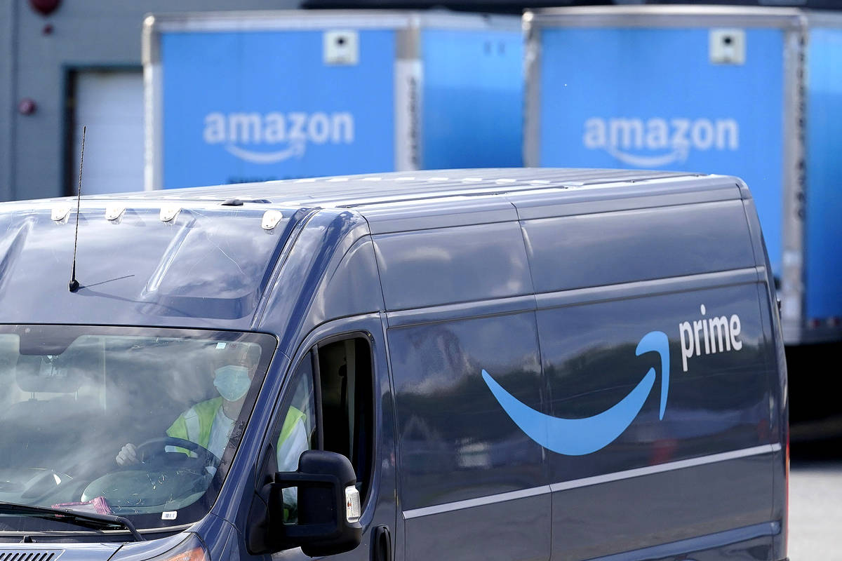 FILE - In this Oct. 1, 2020 file photo, an Amazon Prime logo appears on the side of a delivery ...