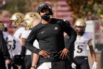 Colorado head coach Karl Dorrell stands on the sideline during the first half of an NCAA colleg ...