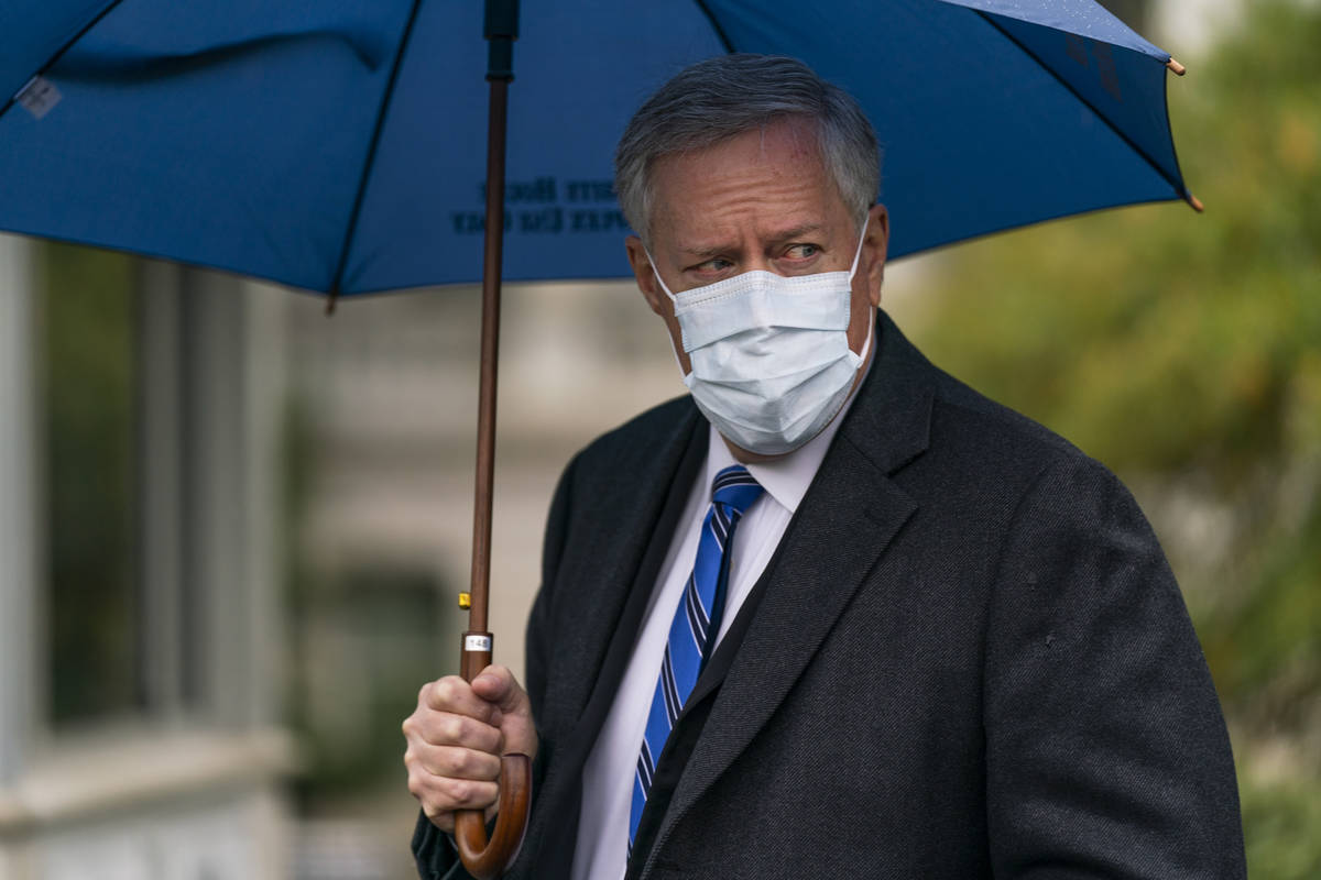 White House chief of staff Mark Meadows responds to reporters questions outside the West Wing o ...