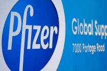 A Pfizer Global Supply Kalamazoo manufacturing plant sign is shown in Portage, Mich., Friday, D ...