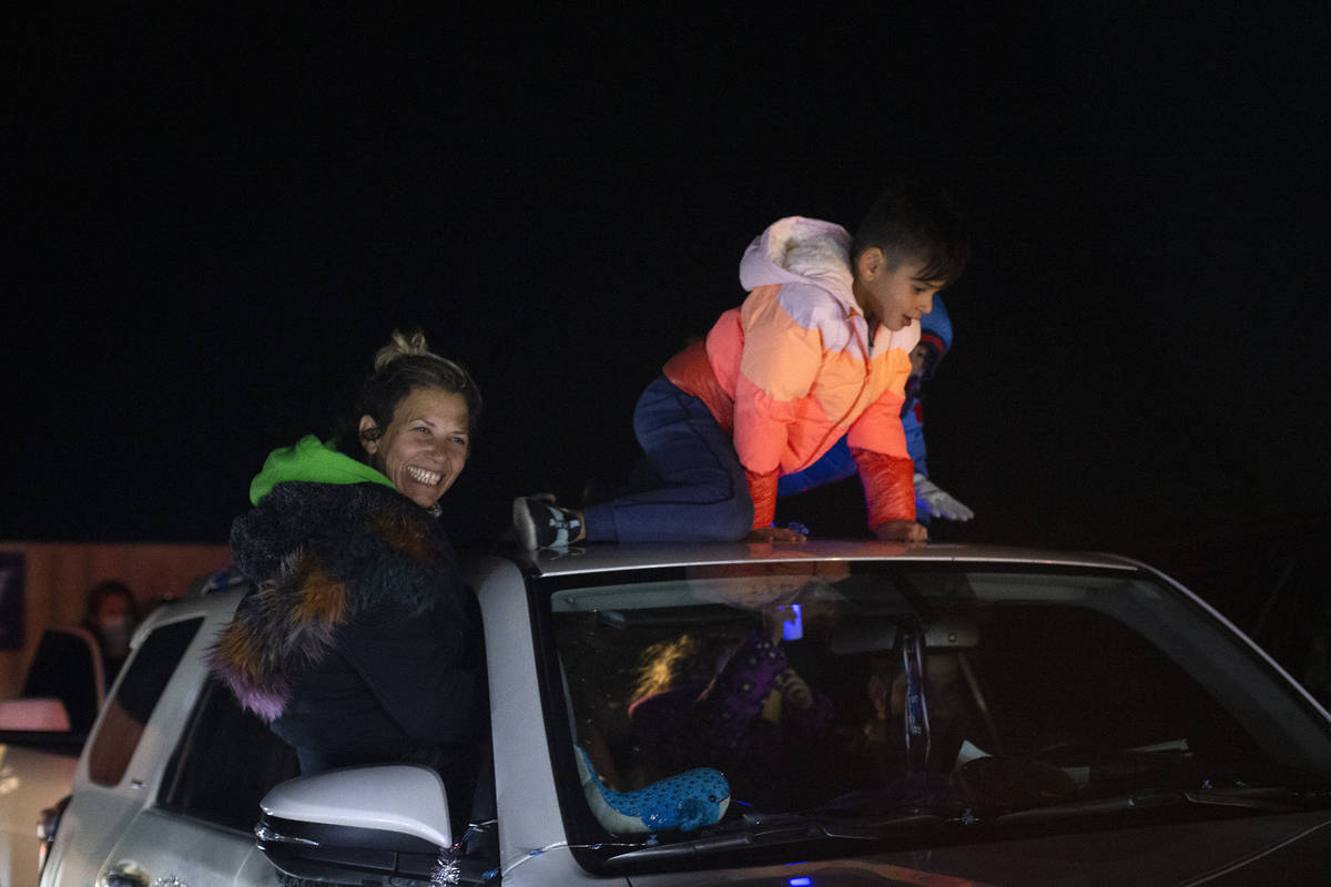 Families line up for a drive-in Hanukkah event at the Israeli American Council Center on Saturd ...