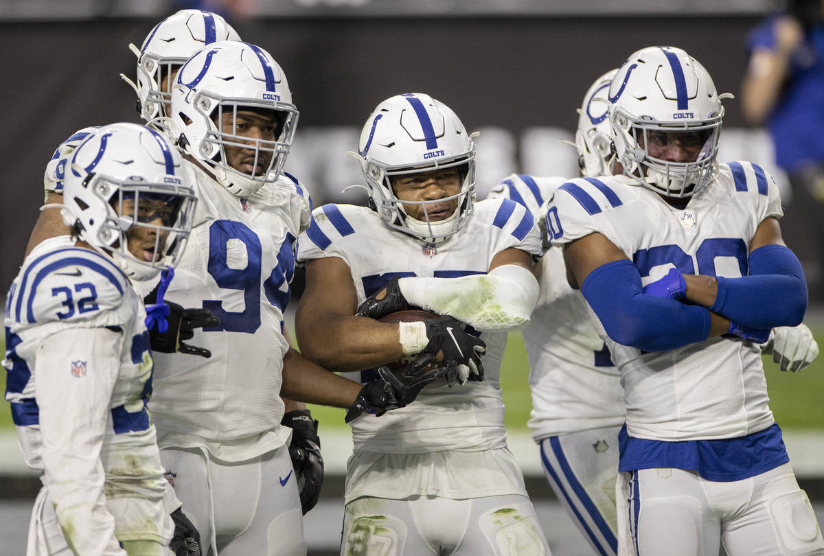 Indianapolis Colts strong safety Khari Willis (37) celebrates a pick six with teammates Indiana ...