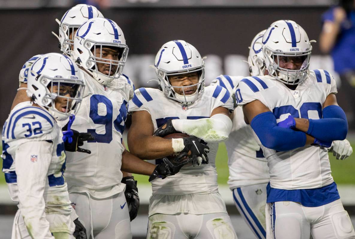 Indianapolis Colts strong safety Khari Willis (37) celebrates a pick six with teammates Indiana ...