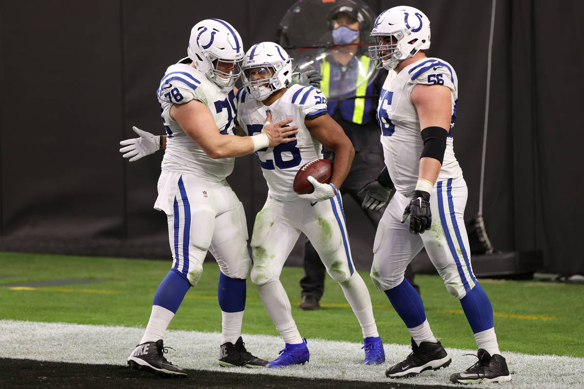 Indianapolis Colts running back Jonathan Taylor (28) celebrates a touchdown with running back J ...