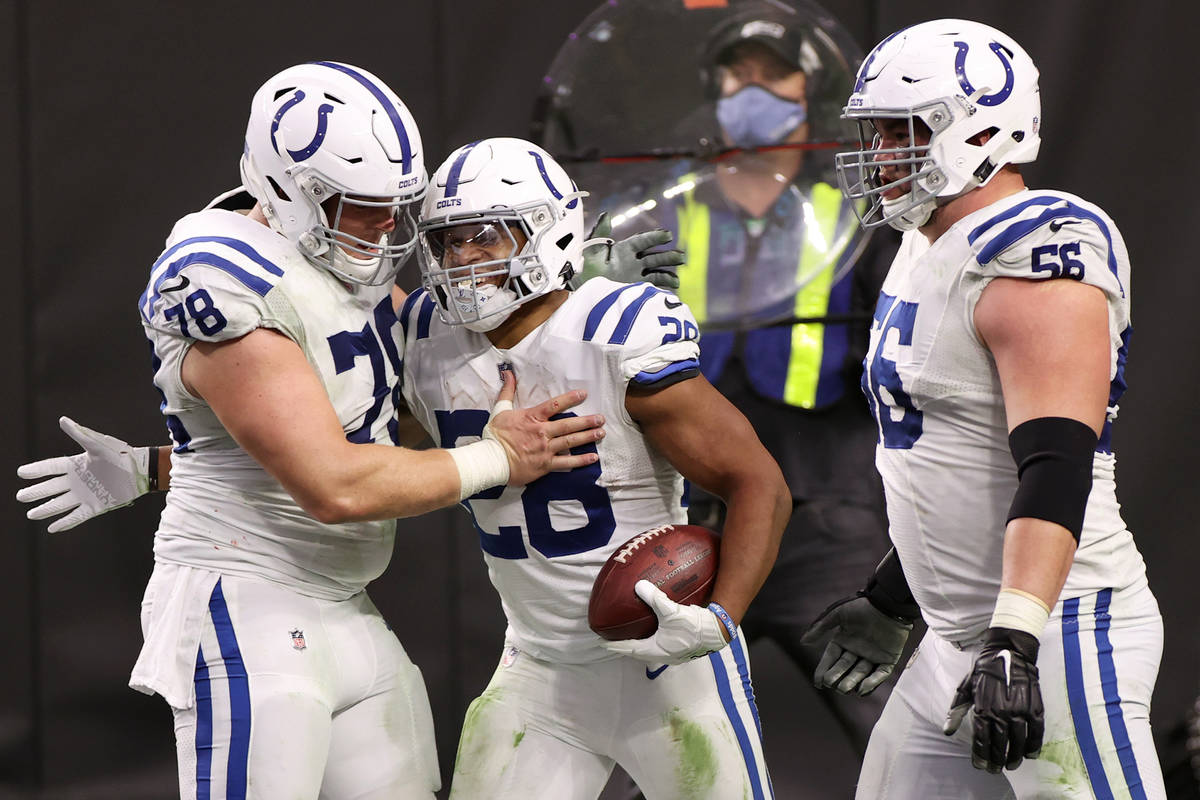 Indianapolis Colts center Ryan Kelly (78) celebrates a touchdown with running back Jonathan Tay ...