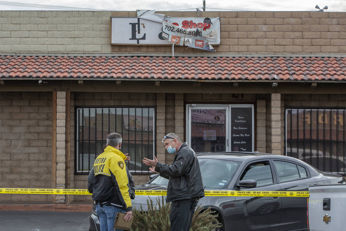 Metropolitan police investigate a homicide in the 3000 block of Contract Avenue on Sunday, Dec. ...