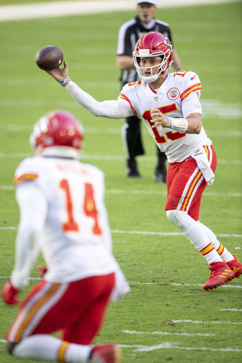 Kansas City Chiefs quarterback Patrick Mahomes (15) throws the ball to Kansas City Chiefs wide ...