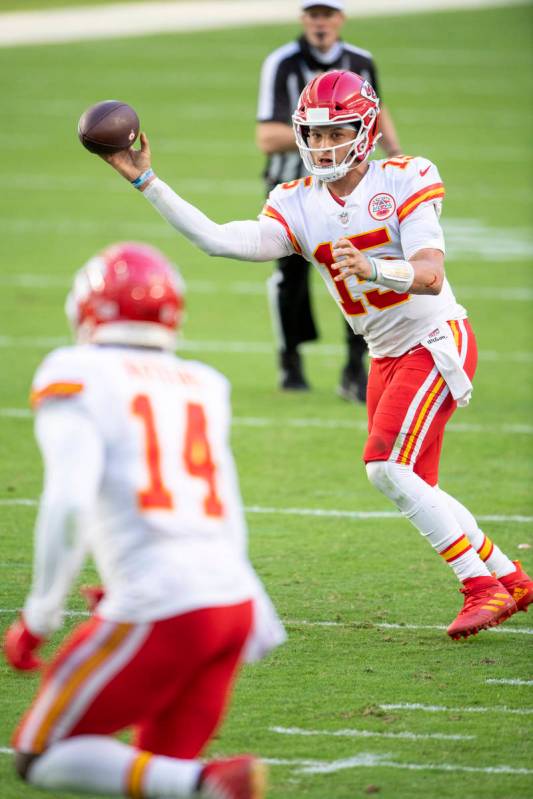 Kansas City Chiefs quarterback Patrick Mahomes (15) throws the ball to Kansas City Chiefs wide ...