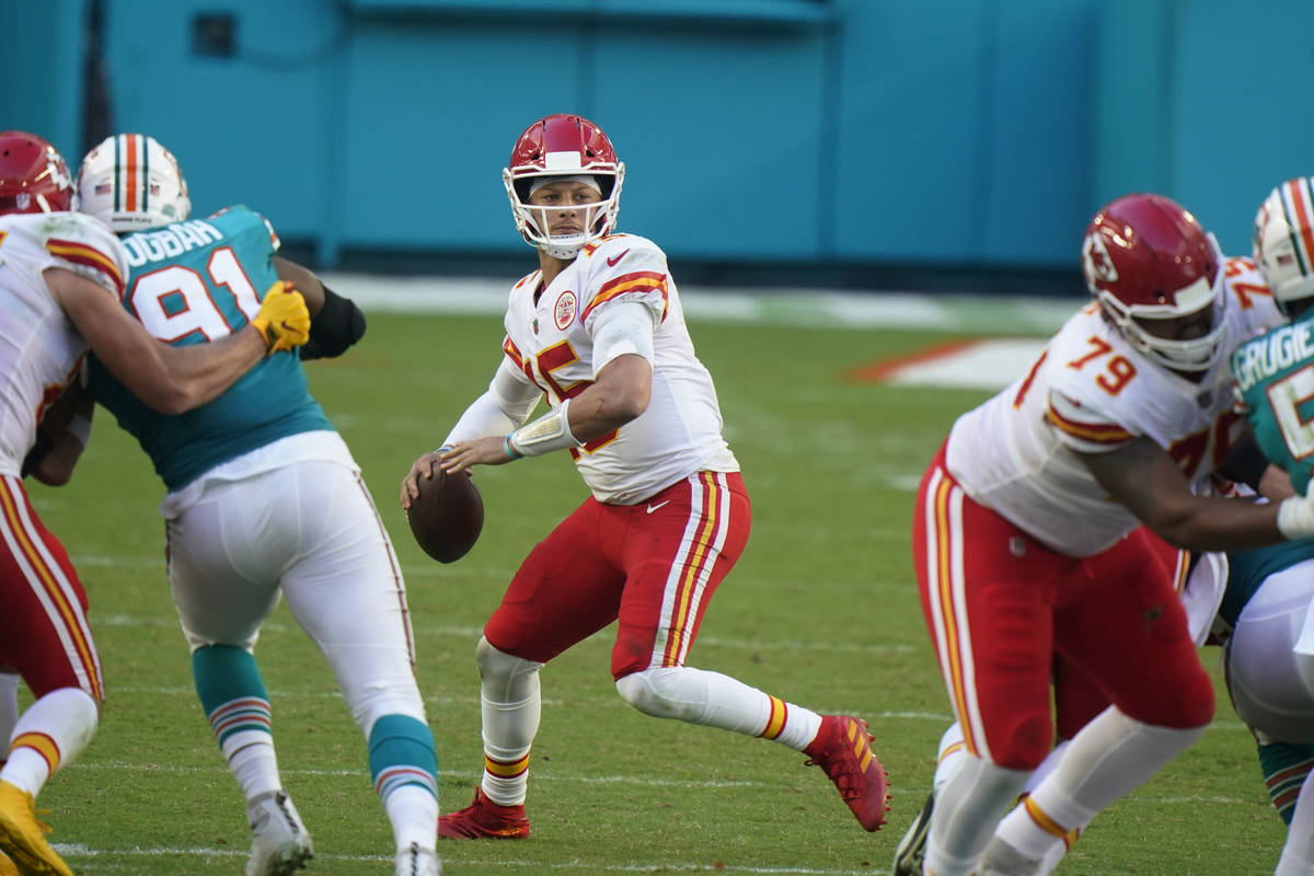 Kansas City Chiefs quarterback Patrick Mahomes (15) aims a pass, during the second half of an N ...