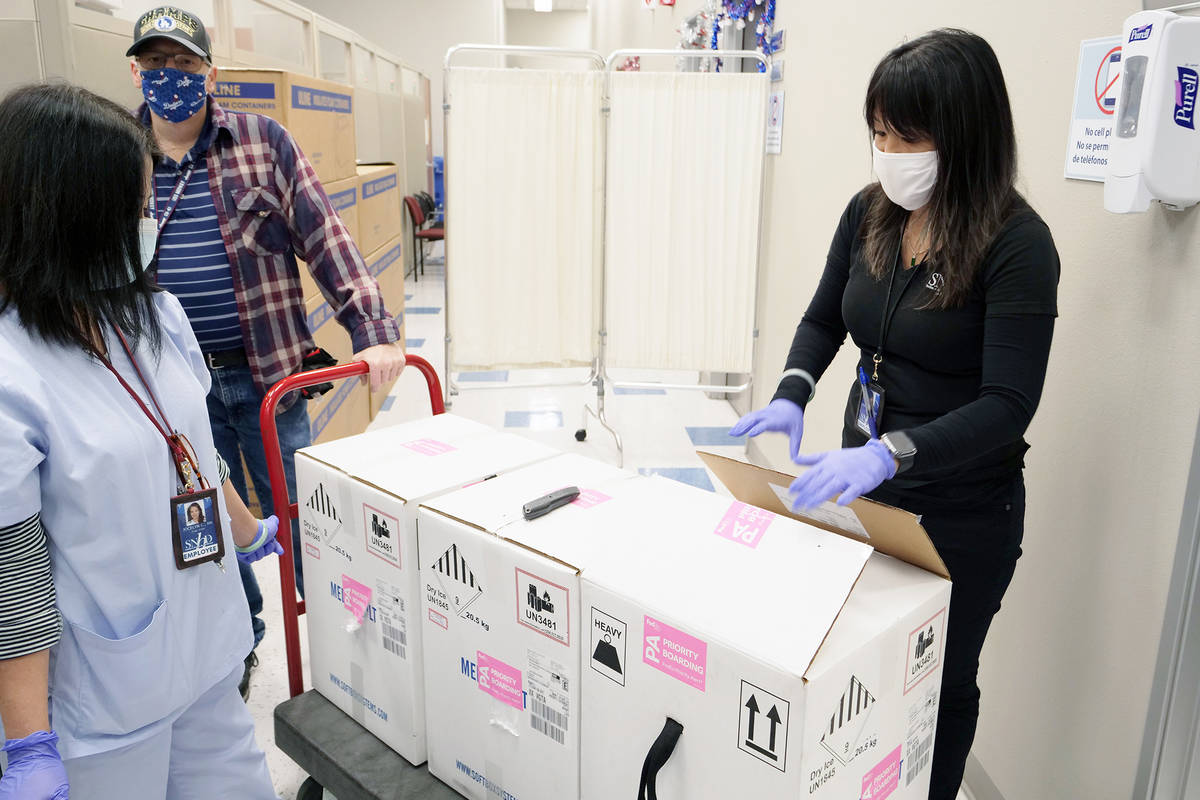 The first doses of COVID-19 vaccine arrive at the Southern Nevada Health District on Monday, De ...