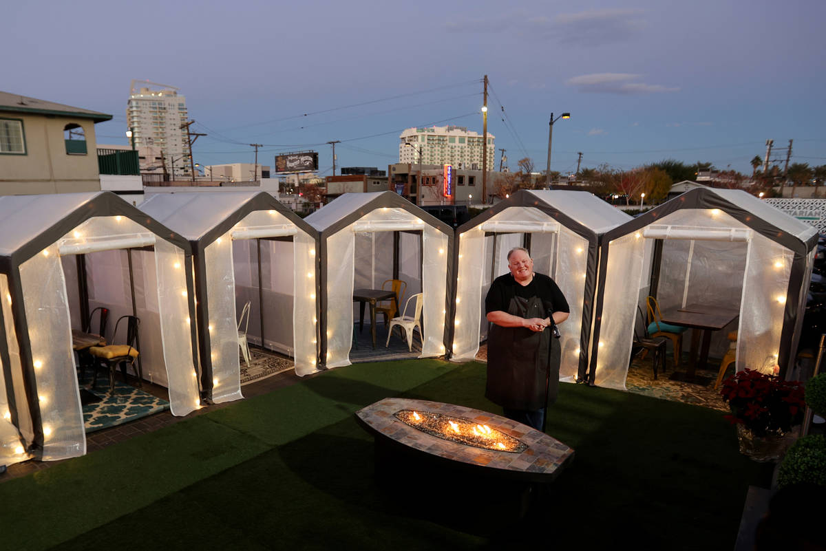 James Trees, owner of Esther's Kitchen, shows outdoor individual dining tents at his downtown L ...