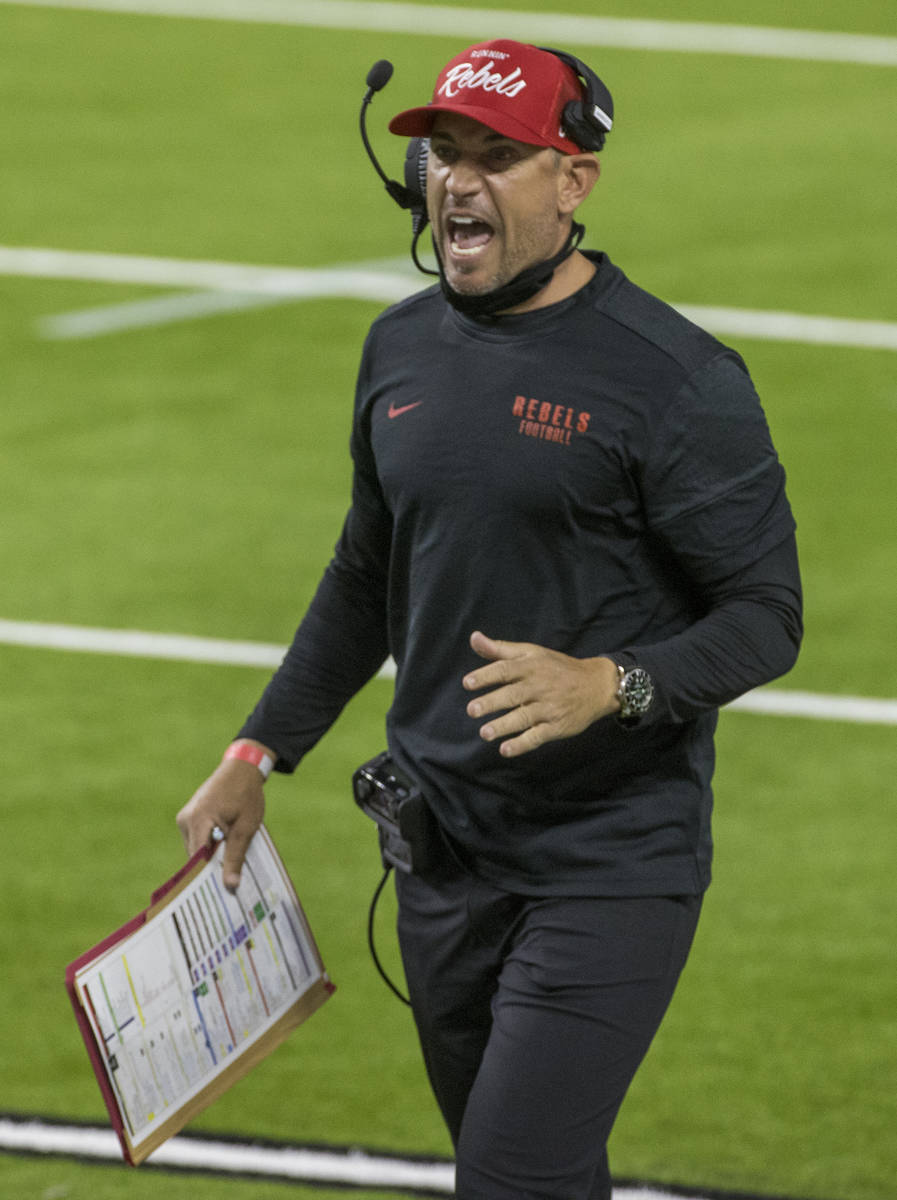 UNLV Rebels head coach Marcus Arroyo yells to his players during the first half of their NCAA f ...