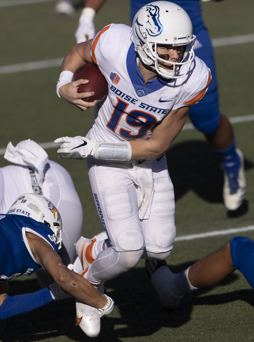 Boise State quarterback Hank Bachmeier (19) scrambles in the first quarter of the Mountain West ...