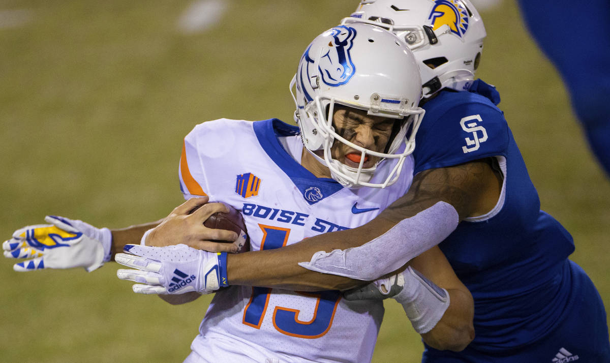 Boise State Broncos quarterback Hank Bachmeier (19) is tackled by San Jose State Spartans safet ...