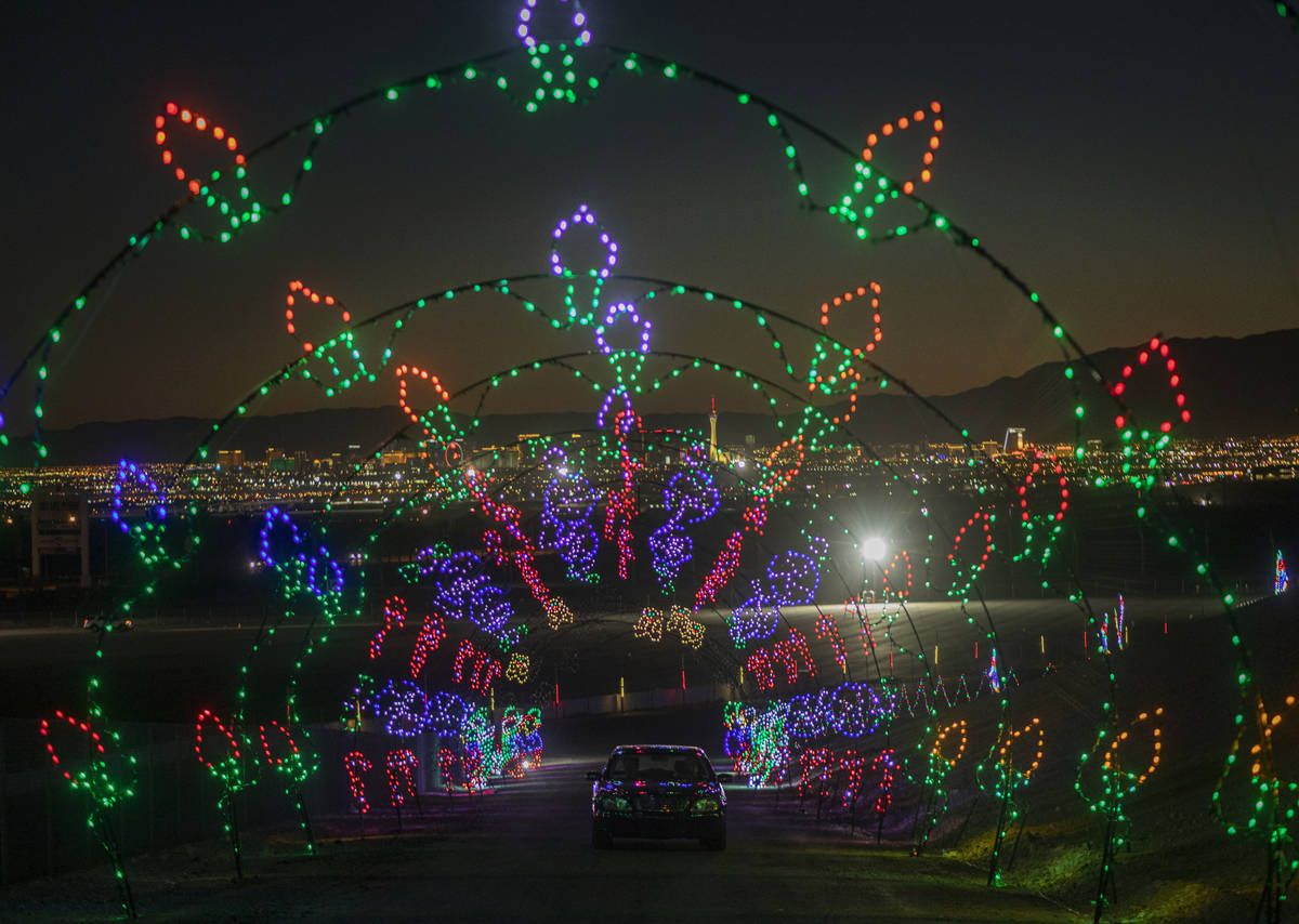 Cars tour through Glittering Lights at Las Vegas Motor Speedway in Las Vegas on Monday Nov. 30, ...