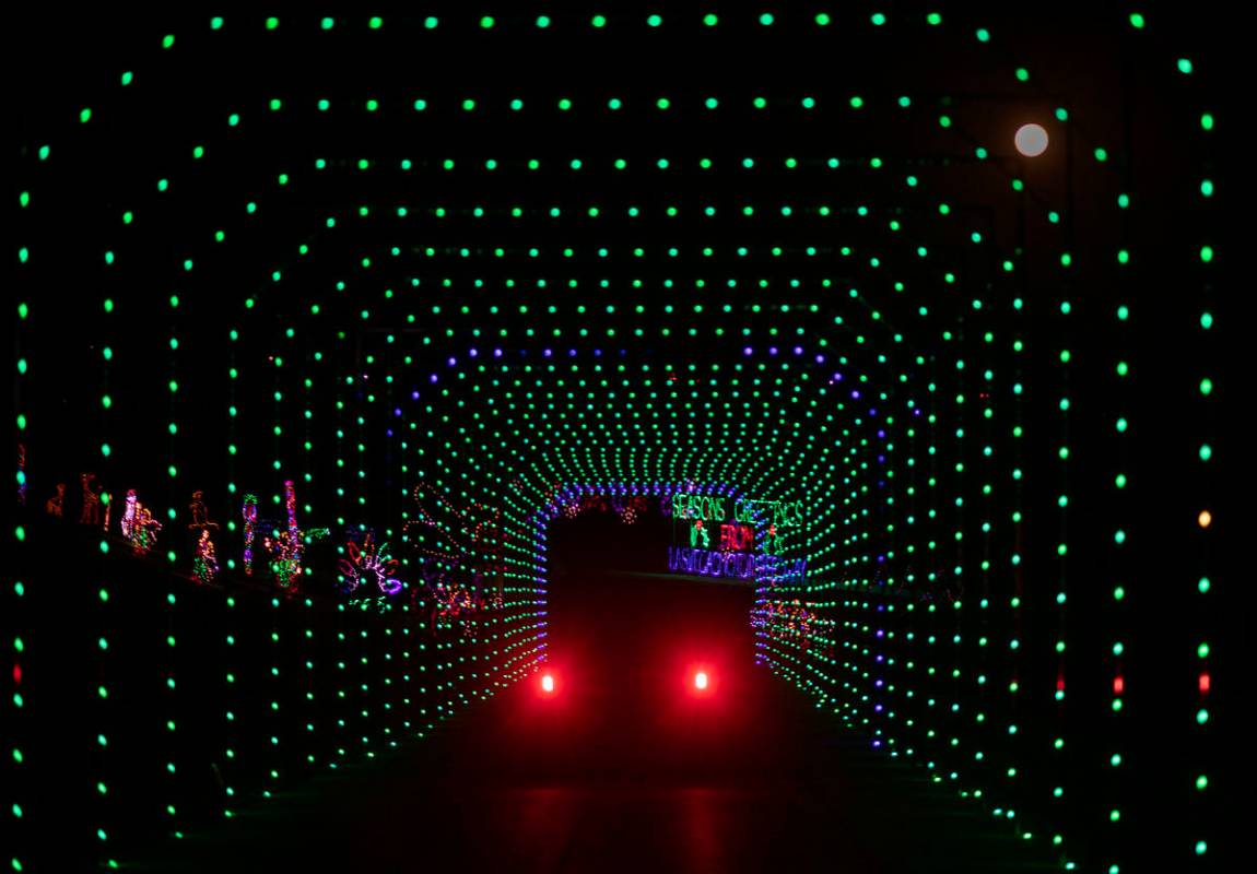 Cars tour through Glittering Lights at Las Vegas Motor Speedway in Las Vegas on Monday Nov. 30, ...