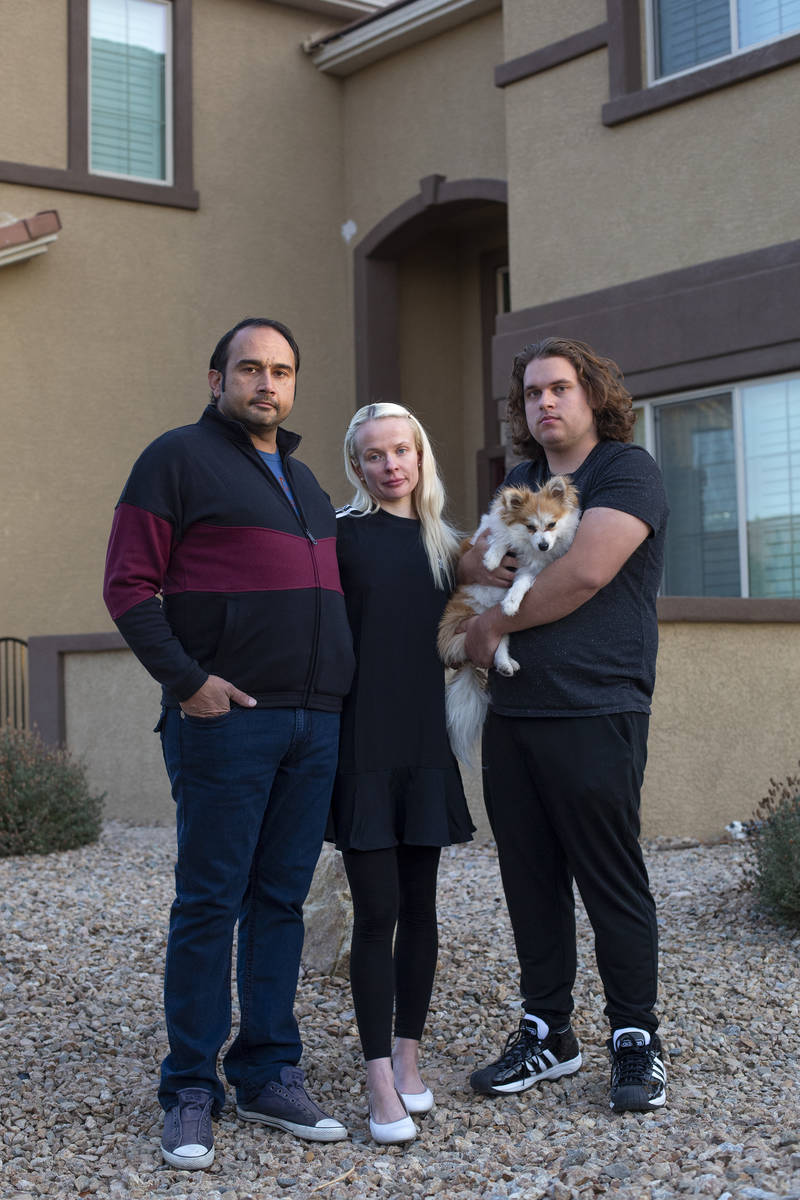 Couple Amit Malik, left, and Klara Turan, center, stand for a portrait with Klara's brother And ...