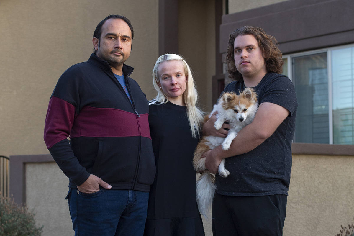 Couple Amit Malik, left, and Klara Turan, center, stand for a portrait with Klara's brother And ...