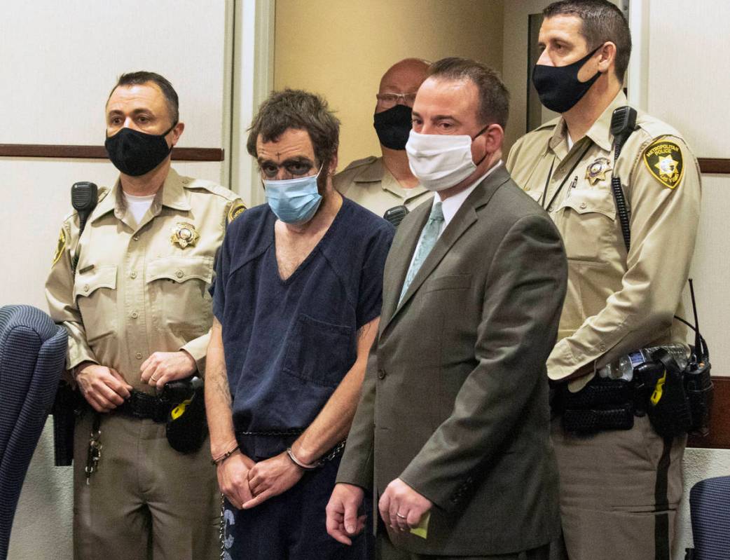 Christopher McDonnell, second left, one of three people charged in a shooting spree in Henderso ...