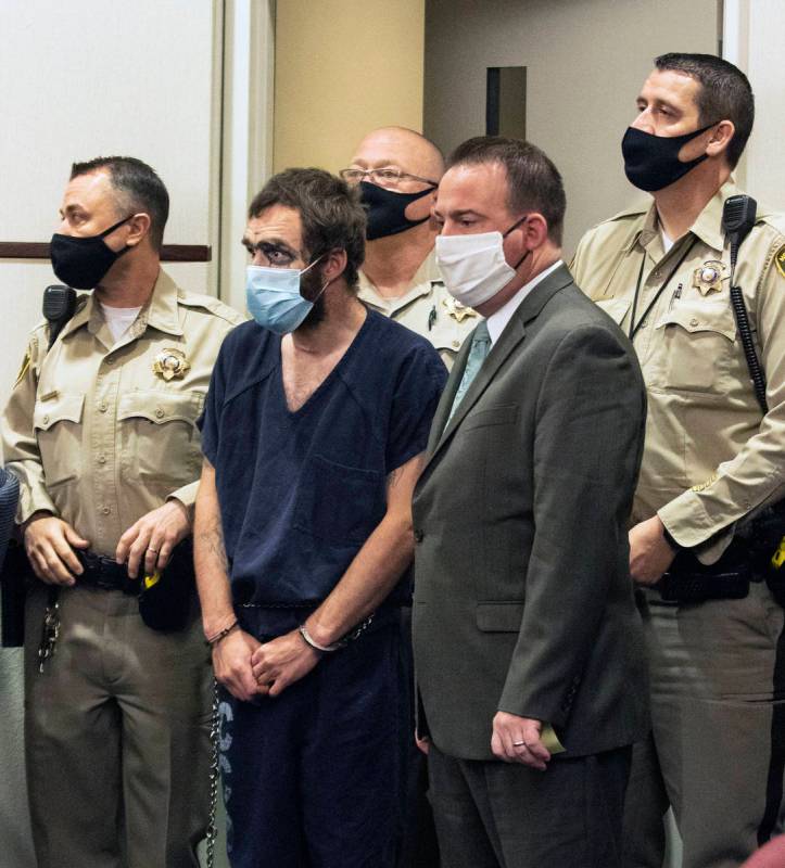 Christopher McDonnell, second left, one of three people charged in a shooting spree in Henderso ...