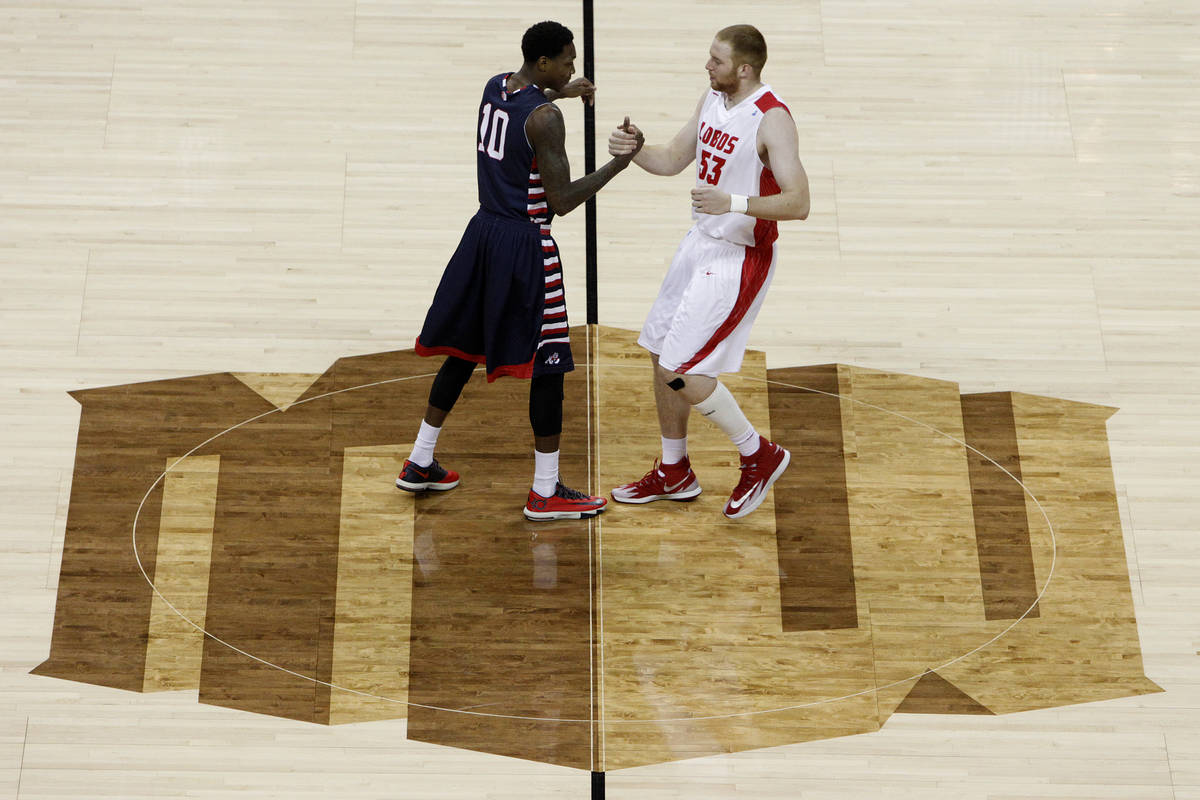 Alex Davis, left, of Fresno State and Alex Kirk of New Mexico shake hands while standing on the ...