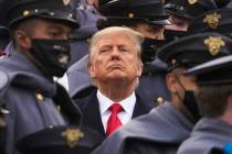 Surrounded by Army cadets, President Donald Trump watches the first half of the 121st Army-Navy ...