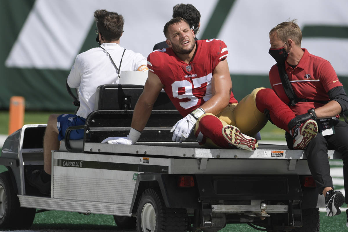 San Francisco 49ers defensive end Nick Bosa (97) is carted off the field after being injured du ...