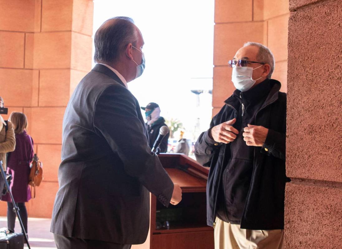 Clark County School District superintendent Dr. Jesus Jara, left, talks to John Vellardita, exe ...