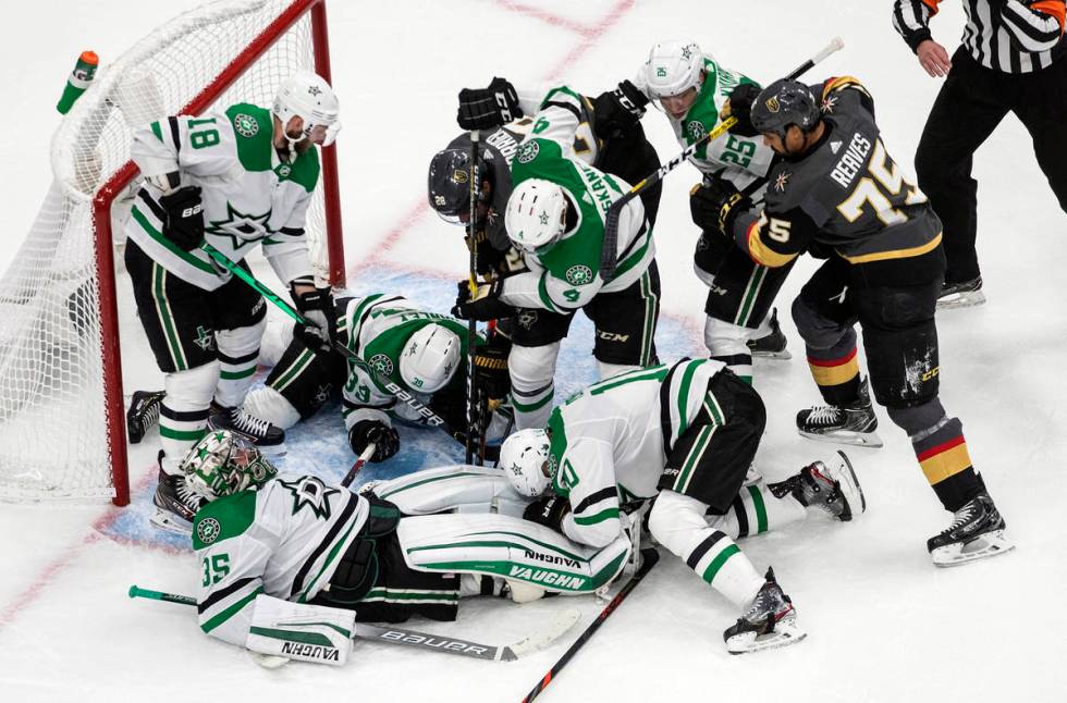 Dallas Stars' goalie Anton Khudobin (35) makes a save and covers the puck against the Vegas Gol ...