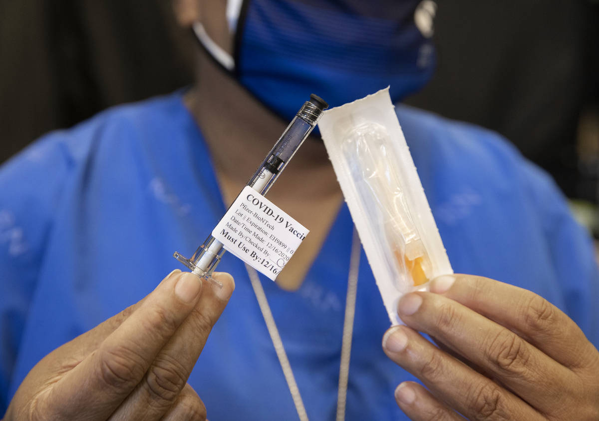 A syringe containing the COVID-19 vaccine at the North Las Vegas VA Medical Center on Wednesday ...