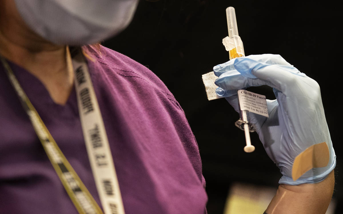 A syringe containing the COVID-19 vaccine at the North Las Vegas VA Medical Center on Wednesday ...