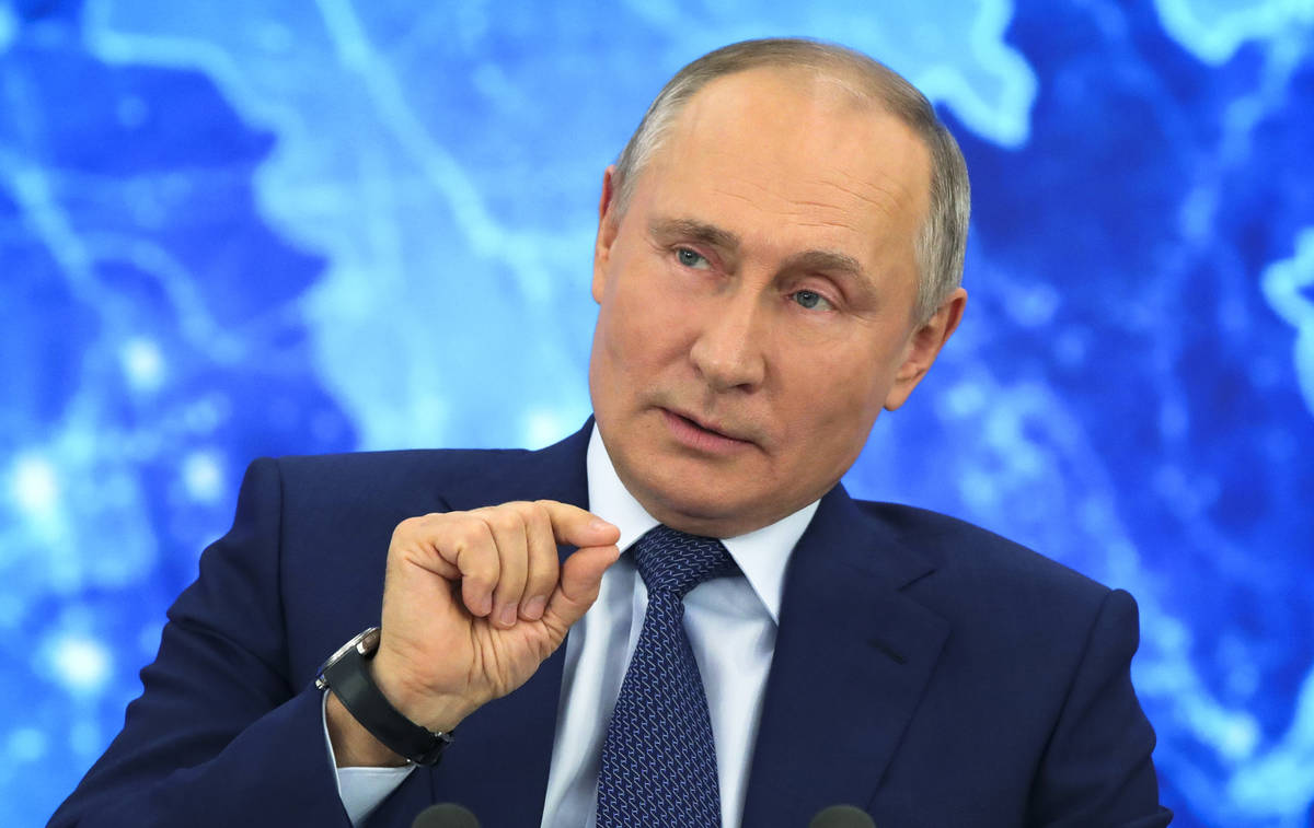 Russian President Vladimir Putin speaks via video call during a news conference in Moscow, Russ ...
