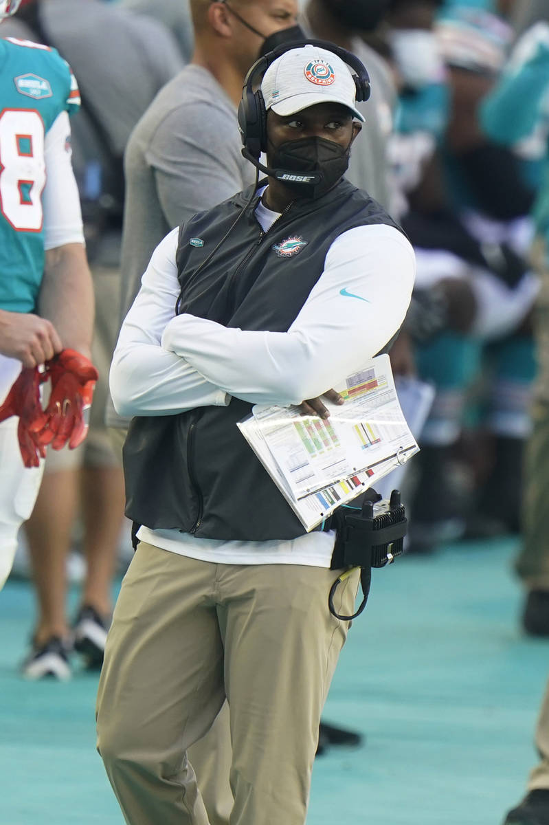 Miami Dolphins head coach Brian Flores watches his team during the second half of an NFL footba ...