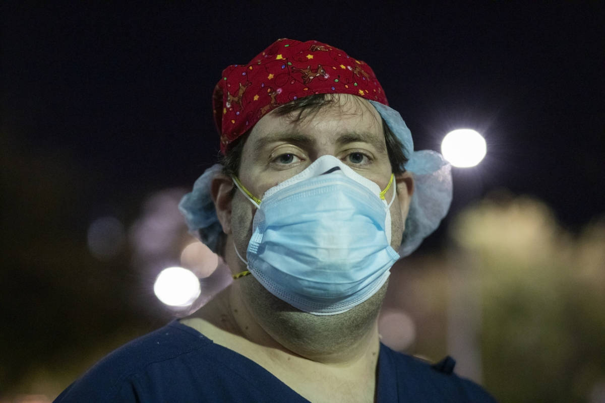 Zachary Pritchett, an intensive care nurse at St. Rose Dominican Hospital, Siena Campus, is see ...