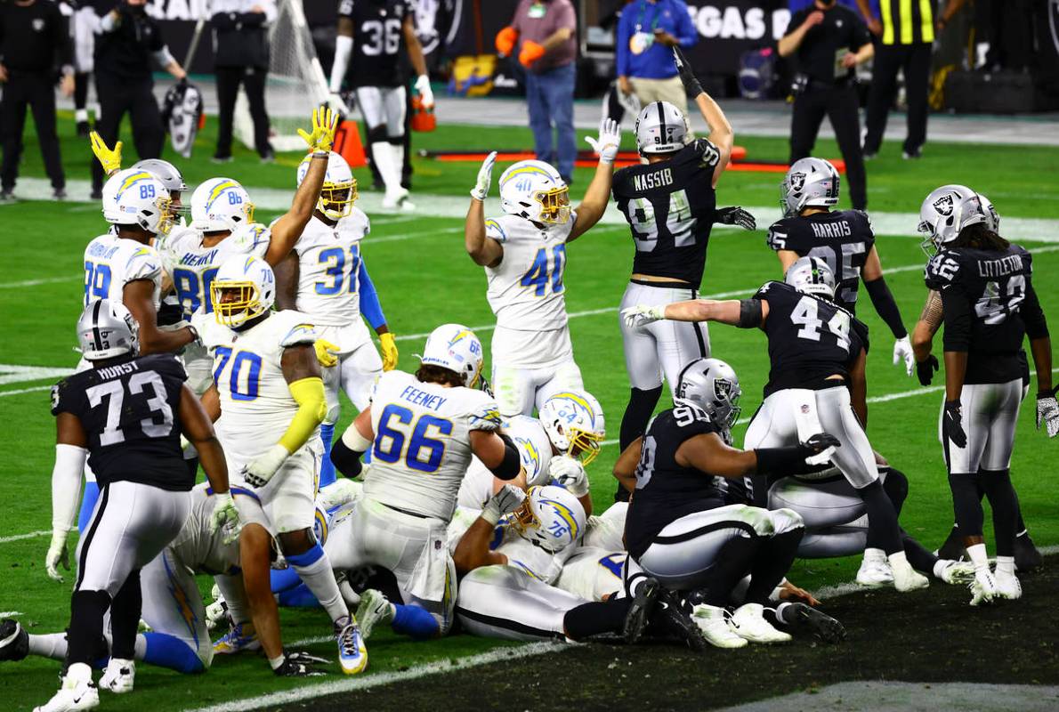The Los Angeles Chargers score a touchdown to defeat the Raiders in overtime in an NFL football ...