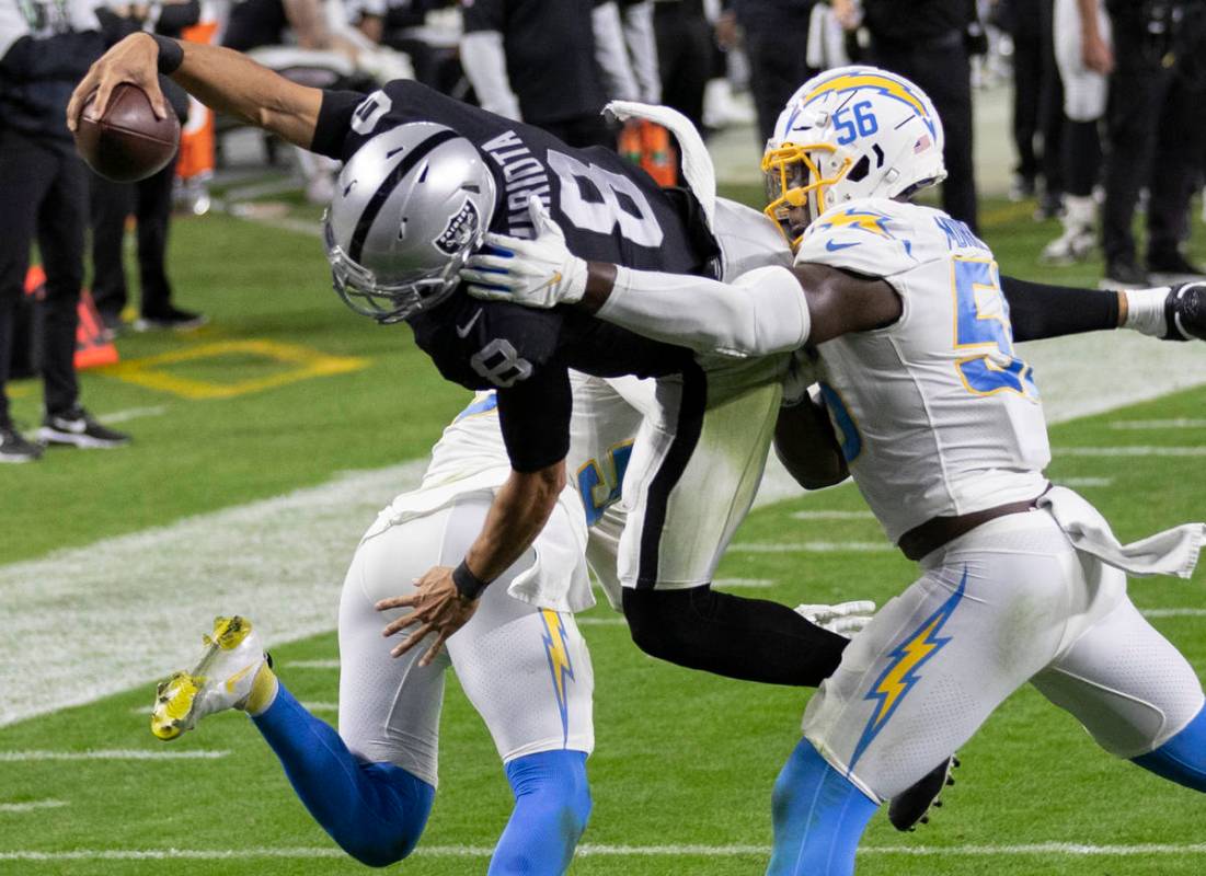 Raiders wide receiver Siaosi Mariner (9) leaps over Los Angeles Chargers outside linebacker Ken ...